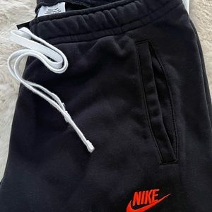 black nike joggers red tick